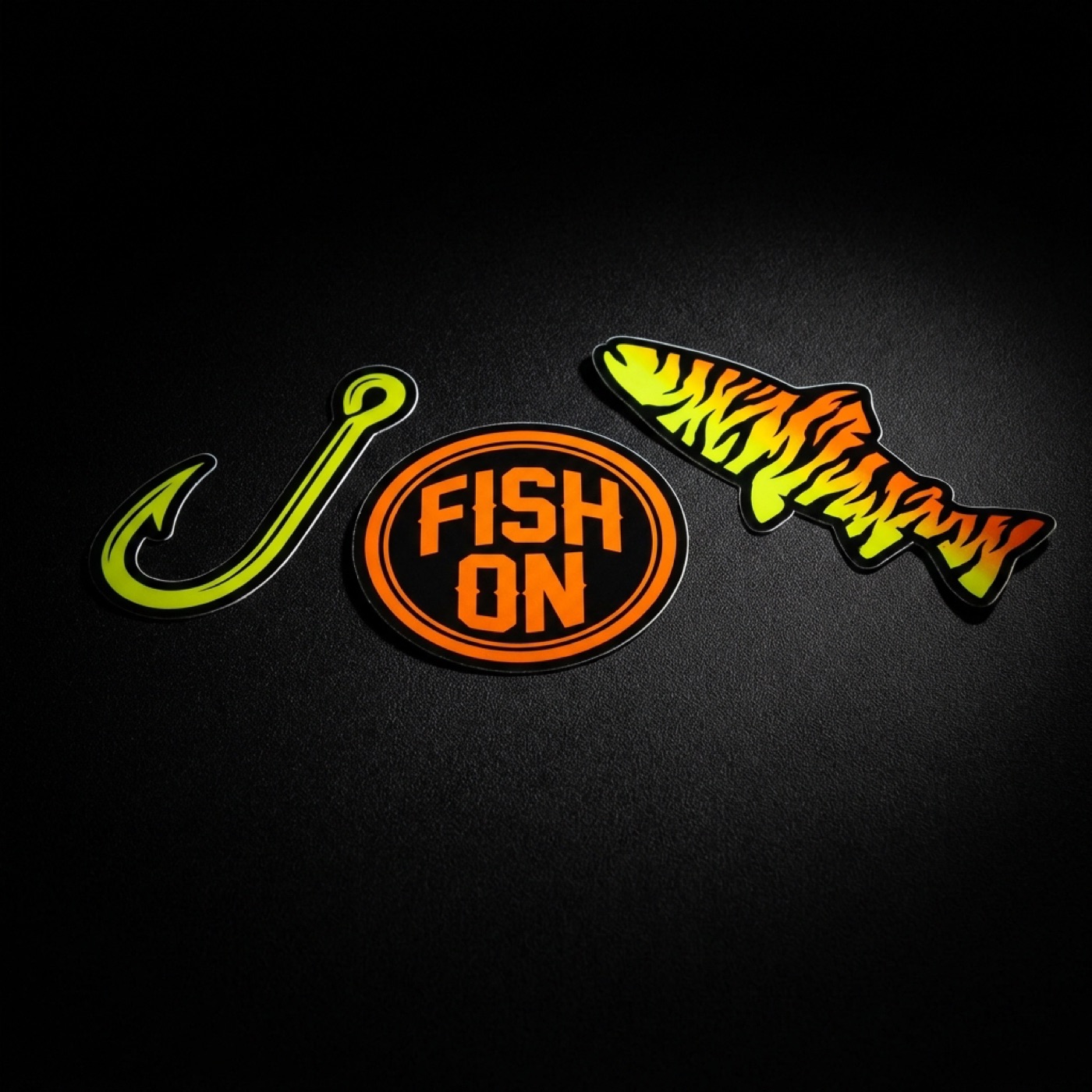 Preview of the Only Finz sticker pack: hook, fish on badge and firetiger fish